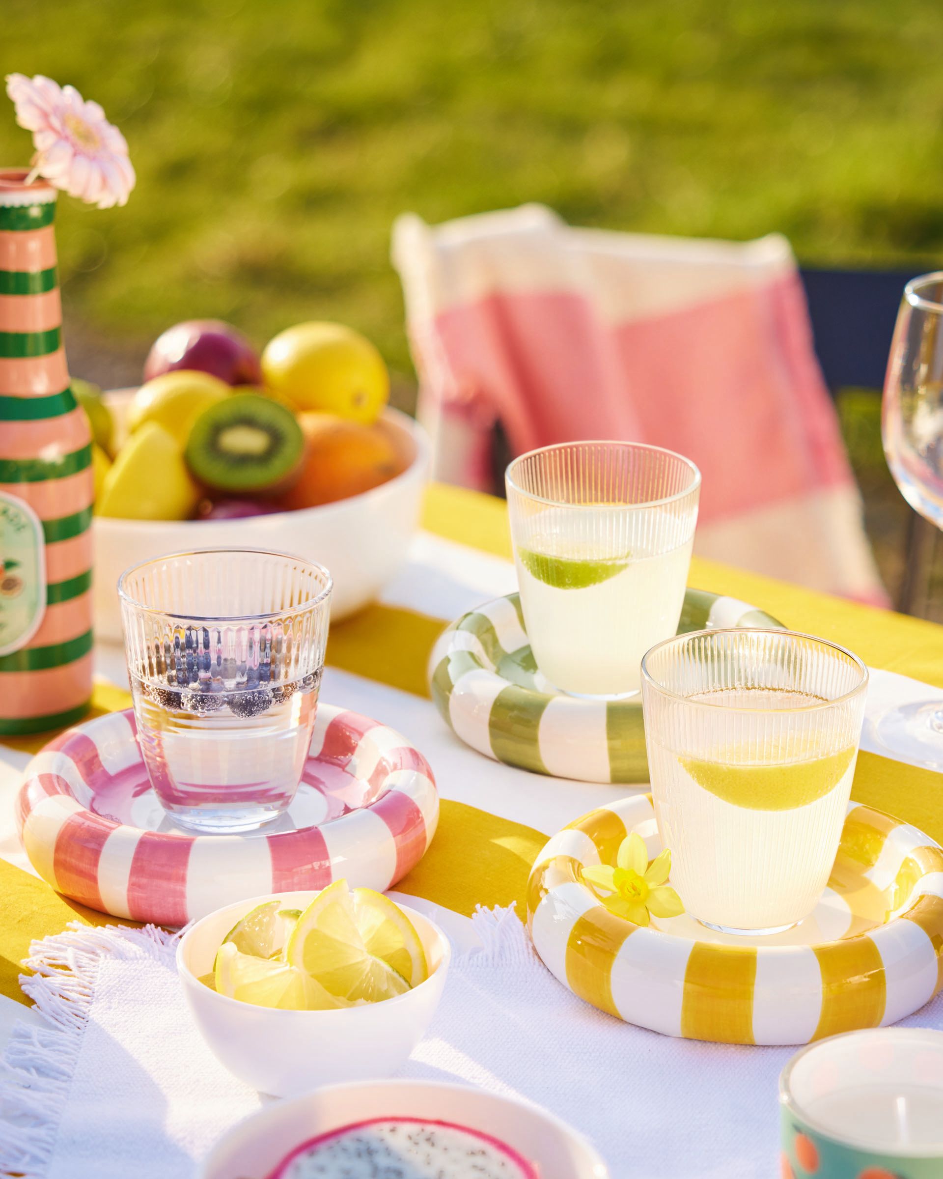 Children decorating a table with Concepto Stripy glassware